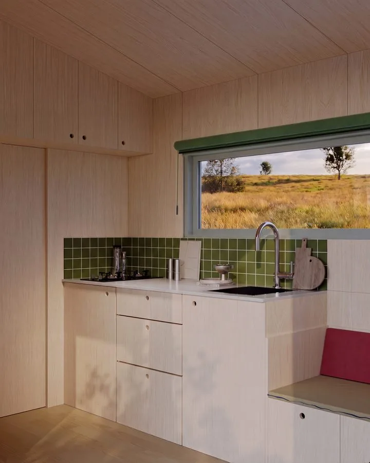 Render of the THOW 3: kitchen unit with green tile splashback, white fronts and window to the meadow, red seat cushion