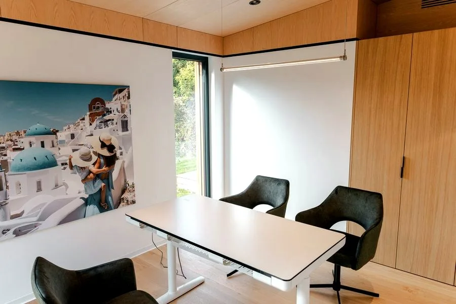Second room in the TR3M showhouse as a study: height-adjustable desk, oak wardrobe, window to the garden
